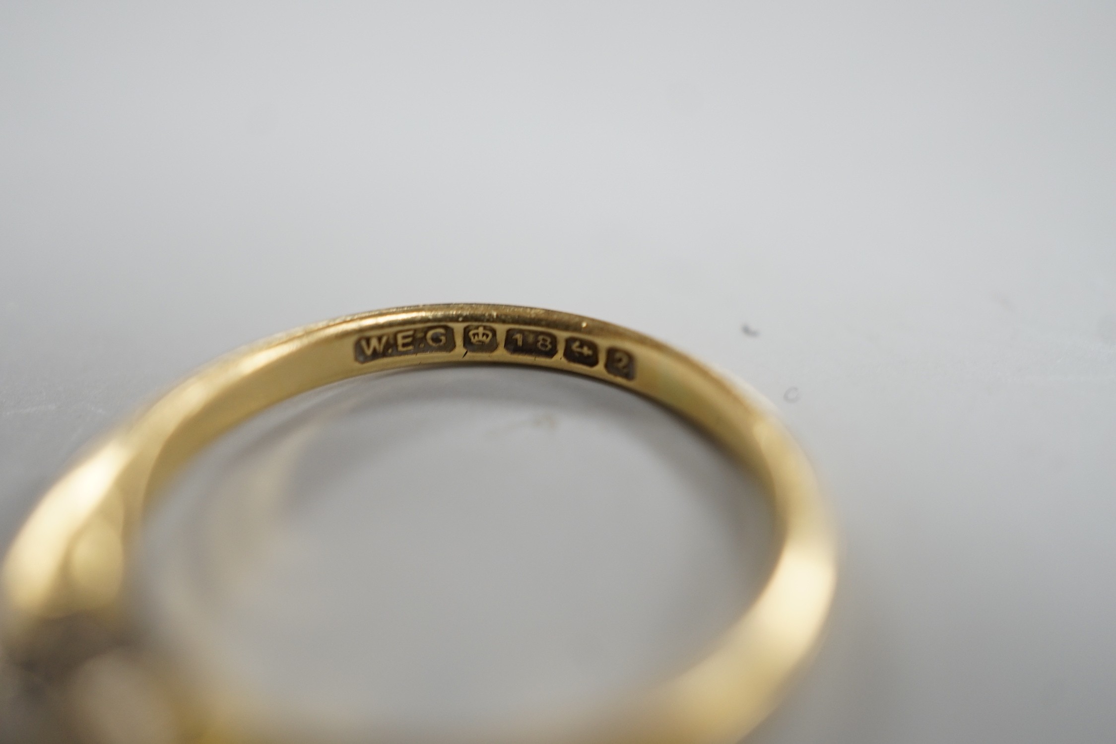 A modern 18ct gold and solitaire diamond ring, size K, gross weight 2.3 grams.
